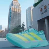 Adidas Giant Shoe Emerges from Banner