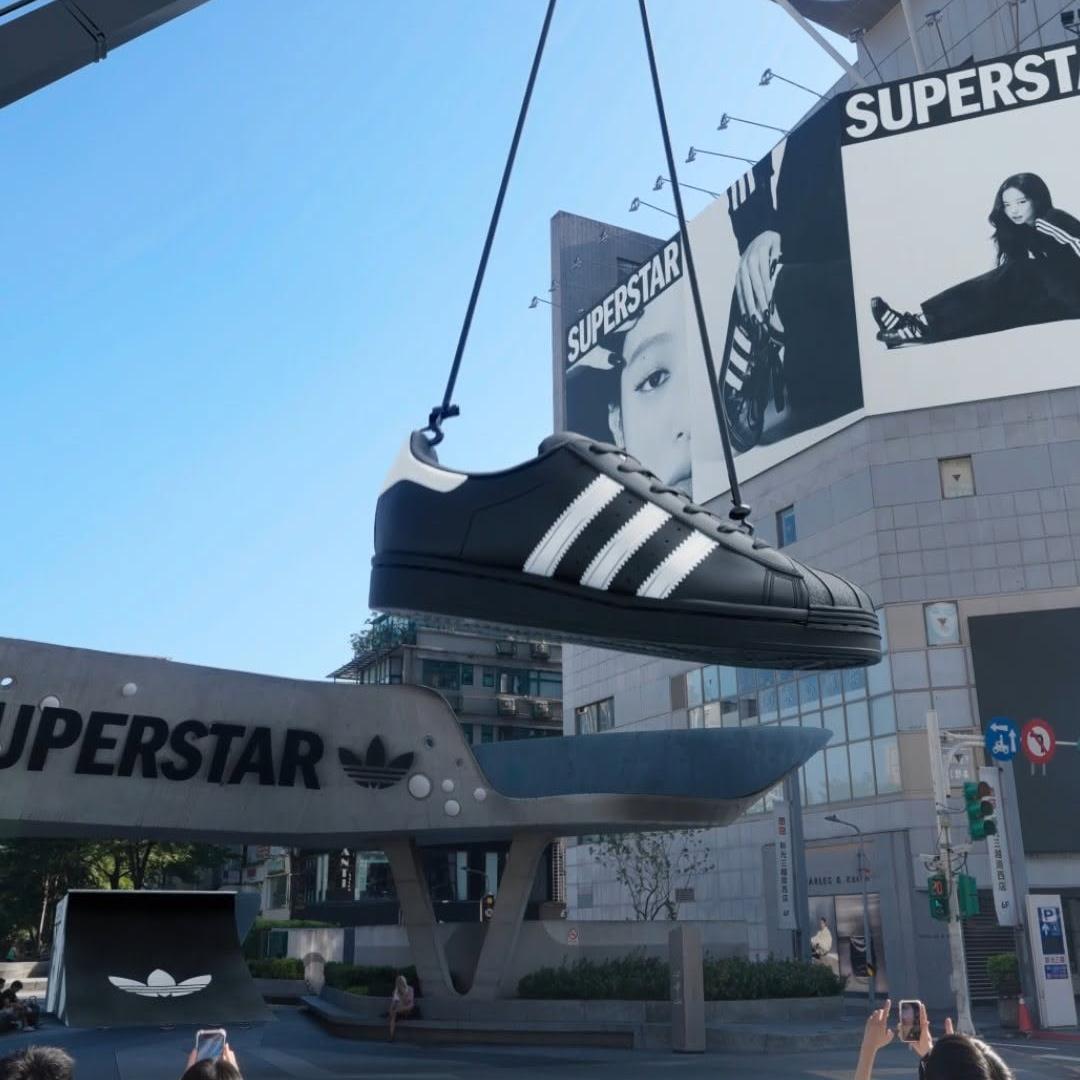 Adidas Giant Shoe Skateboards Through City