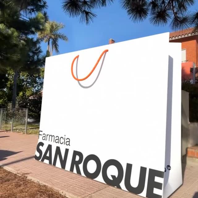 Farmacia San Roque Giant Shopping Bags Glide Through Street