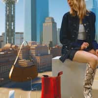 Shopbop Woman Surrounded by Fashion Carousel