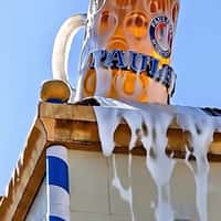 Paulaner Giant Beer Mug Overflows Atop Building
