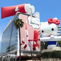 MOON Hello Kitty Holding Electric Brush on Building