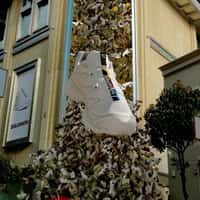 Salomon Giant Sneaker Crashes Through Facade
