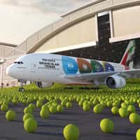 Emirates Airplane Pushes Through Tennis Balls