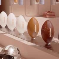 Fenty Beauty Footballs Sprayed on Conveyor Belt