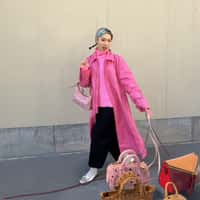 MCM Woman Walks Bags on Leashes