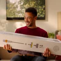 Dyson Vacuum Box Lands on Man's Arms