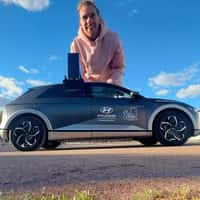 Hyundai Giant Man Leaps and Shrinks Beside Car