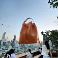 Bimba y Lola Floating Bucket Bags Over City