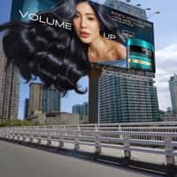 L’Officiel Model's Hair Flows Out of Billboard