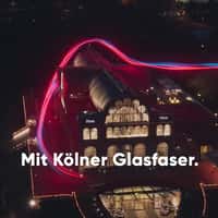 NetCologne Light Trail Approaches Through Flora Köln