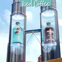 Nescafé Towers Open to Reveal Giant Coffee Bottles