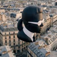 Karl Lagerfeld Head Sculpture Floats Over Paris