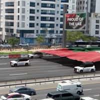Nissan Cars Pull Giant UAE Flag on Highway