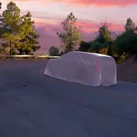 Hyundai Covered Mystery SUV Cruising on Street