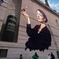 Filorga Serum Applied to Woman’s Face on Mural