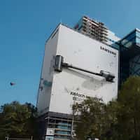Samsung AI Vacuum on Billboard Sweeping the Street