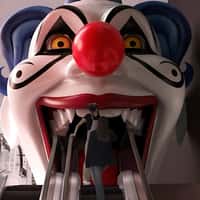 Galeries Lafayette Clown Head Emerges at Escalator