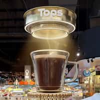 Nescafé Clear Cup Filled with Coffee by Ceiling Machine