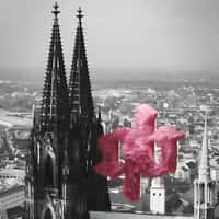 A Quick Buck Pink Fuzzy Logo Floats Above Cologne Cathedral