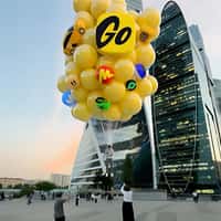 Yandex Go Man Lifted by Yellow Balloons Stunt
