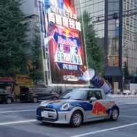 Red Bull Cars Displaying Hologram Poster in Tokyo