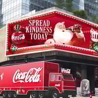 Coca-Cola Truck Collects Gifts From Billboard