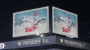 Snow Splashes as Woman Skis in a 3D Billboard ad of Austria