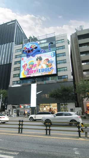 Derpy Tiger Leans Forward Above Saja Boys in a 3D Billboard ad of Netflix