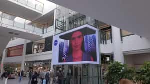 Robotic Arm Places Bottle Center Screen in a 3D Billboard ad of Nivea
