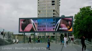 Audiobooks on Outer Space Background  in a 3D Billboard Ad of Audible