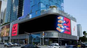 Viper Punches Screen in a 3D Billboard ad of Valorant