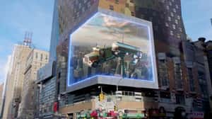 Man Clings to Rope Beside Floating Truck in a 3D Billboard ad of Sony