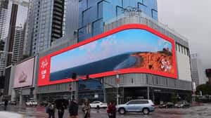 Paraglider Breaks Through Billboard in a 3D Billboard ad of Visit San Diego