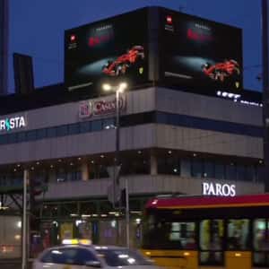 F1 Car Drives In and Reveals Box in a 3D Billboard ad of LEGO