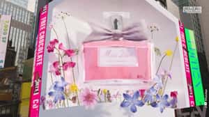 Perfume Rotates Above Spring Flowers in a 3D Billboard Ad of Dior