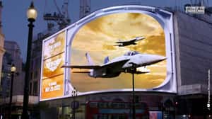 Fighter Jets Fly at Sunset in a 3D Billboard Ad of TOP GUN