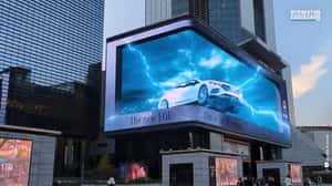 Car Moves with Electric Charges in a 3D Billboard Ad of Mercedes-Benz