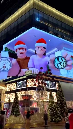 Family Giving Gifts on Screen in a 3D Billboard Ad of Samsung
