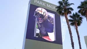 Football Player Leans Out of Screen in a 3D Billboard Ad of MGM