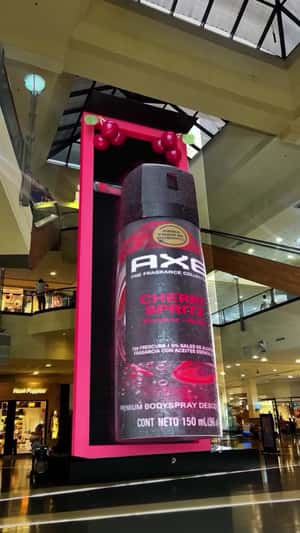 Bottle Rotates as Banner Rolls in a 3D Billboard Ad of Axe
