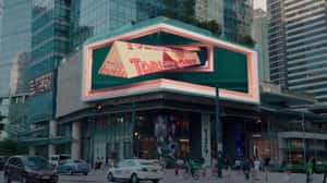 Package Emerges Through Mailbox in a 3D Billboard ad of Toblerone