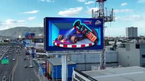 Tire Shine Sprays on F1 Car in a 3D Billboard Ad of Armor All 