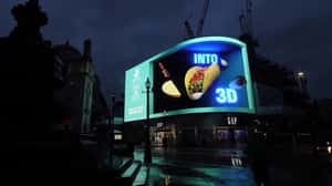 Ingredients Orbit Around Giant Taco in a 3D Billboard ad of Deliveroo 