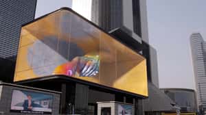 Dancers' Limbs Reach Beyond the Screen in a 3D Billbioard ad of Unknown