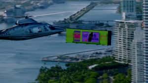 Bottle Emerges Twists from Floating Screen in a 3D Billboard ad of Smirnoff 