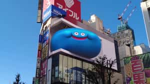 Dragon Quest Slimes Crammed In Until They Bulge Out in a 3D Billboard ad of Unknown