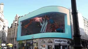 Logo Floats Out After Assembly in a 3D Billboard ad of Visualise