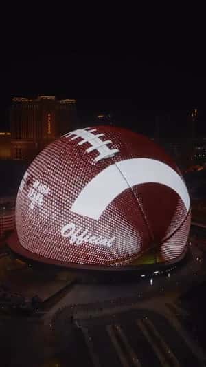 Football Spins Fast in a 3D Billboard ad of Unknown