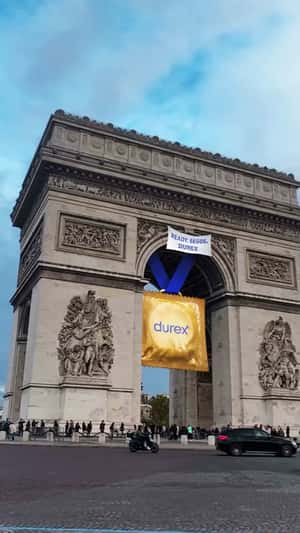 Gold-wrapped Condom Hangs in a fake-out-of-home ad of Durex